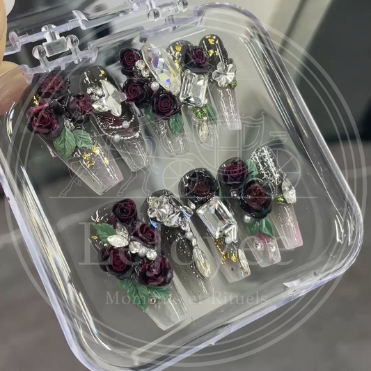 Luxury handmade "Luminous-Rose-Quartz" press-on nails, featuring a striking design of black roses, faceted green gemstone shapes, and exquisite rhinestone detailing.