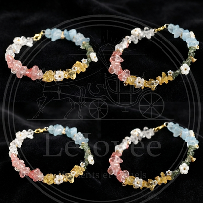 Four exquisite crystal energy bracelets are placed within a black velvet cloth, fully showcasing their vibrant rainbow colors and gentle feminine charm.