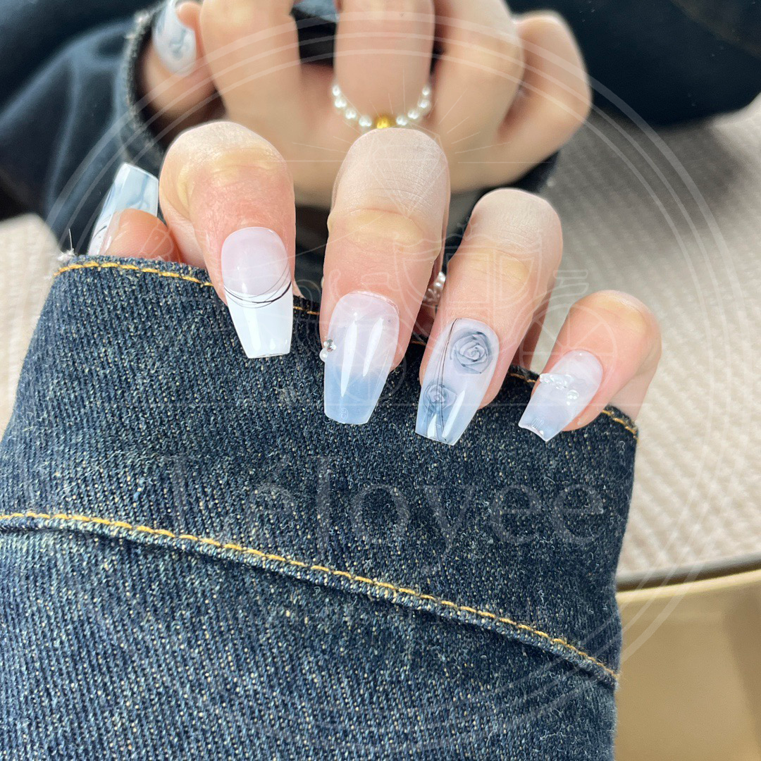Macro shot showing fine black circular lines and arcs overlaying the floral design, adding a modern minimalist touch to the set.
