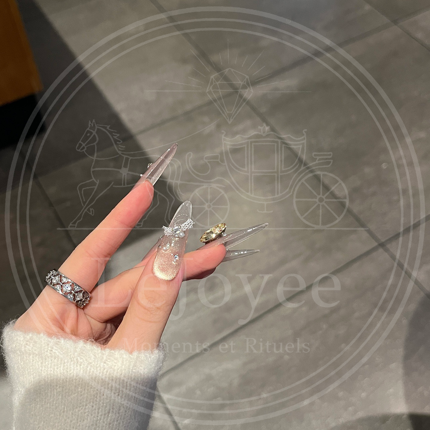 LéJoyee’s Lustre Bloom handmade press-on nails with soft shimmer, fashion accents, and rhinestone centerpieces.