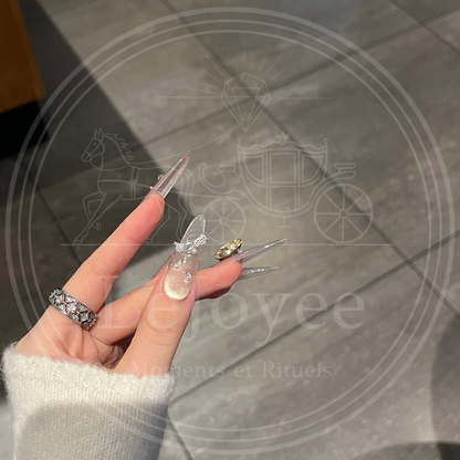 LéJoyee’s Lustre Bloom handmade press-on nails with soft shimmer, fashion accents, and rhinestone centerpieces.