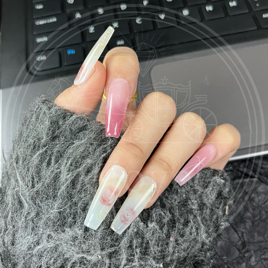 Long coffin-shaped floral press-on nails designed for a romantic, cottagecore, or wedding guest aesthetic.