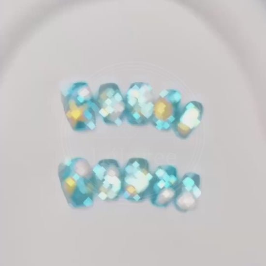 Video capturing the glossy, water-like finish and the dimensional details of the seashell art on the Seafoam Daydream press-on nails.