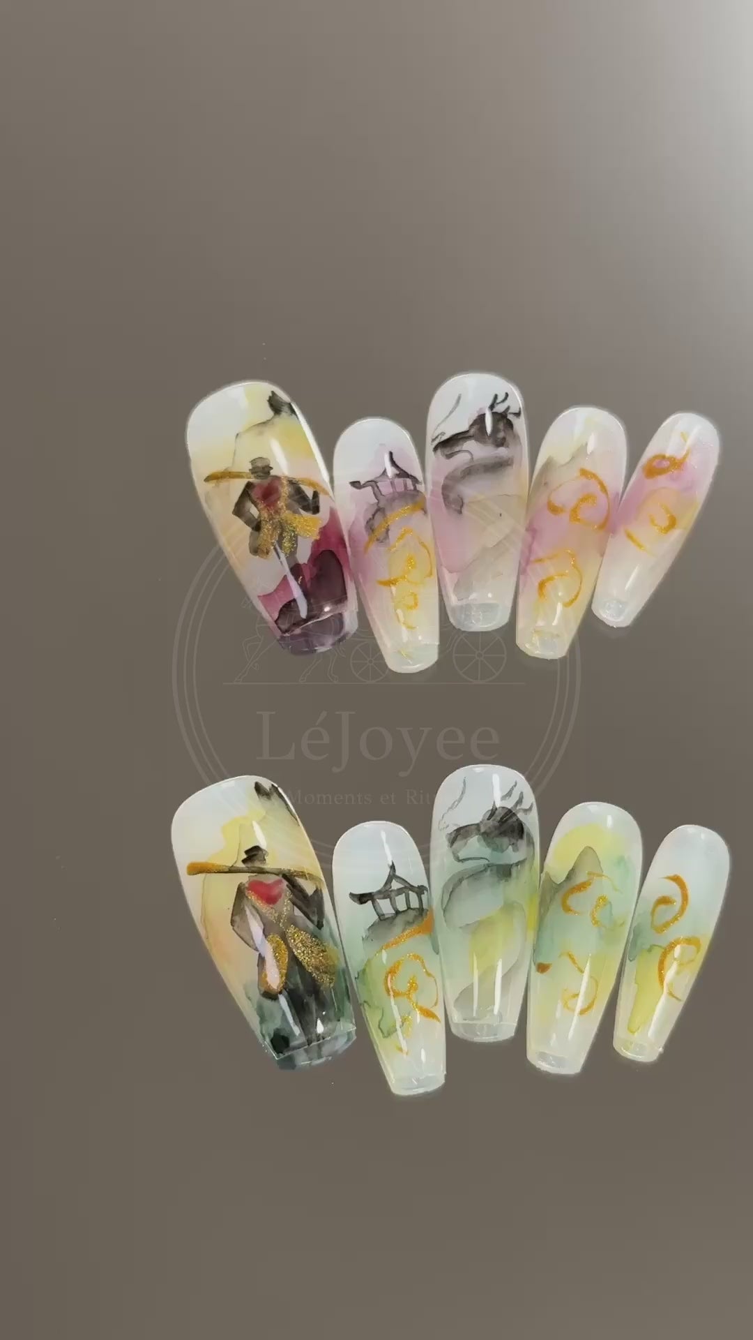 Video showcasing the light reflecting off the gold metallic accents and the depth of the semi-transparent ink-wash layers on the Celestial Odyssey nails.